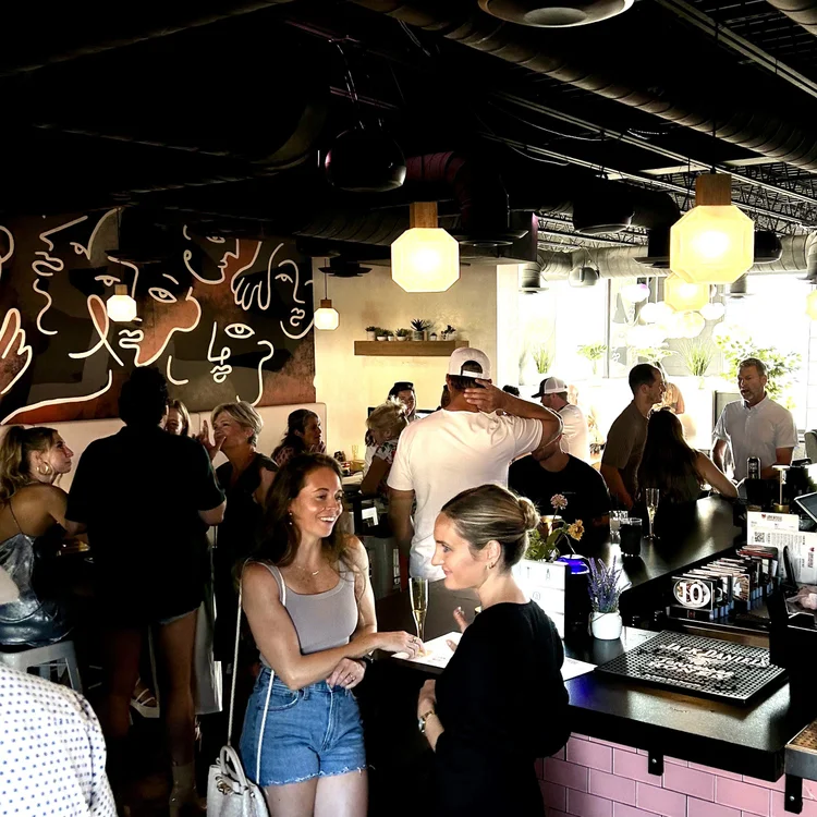 Lively crowd inside Love & Exile bar in Nashville